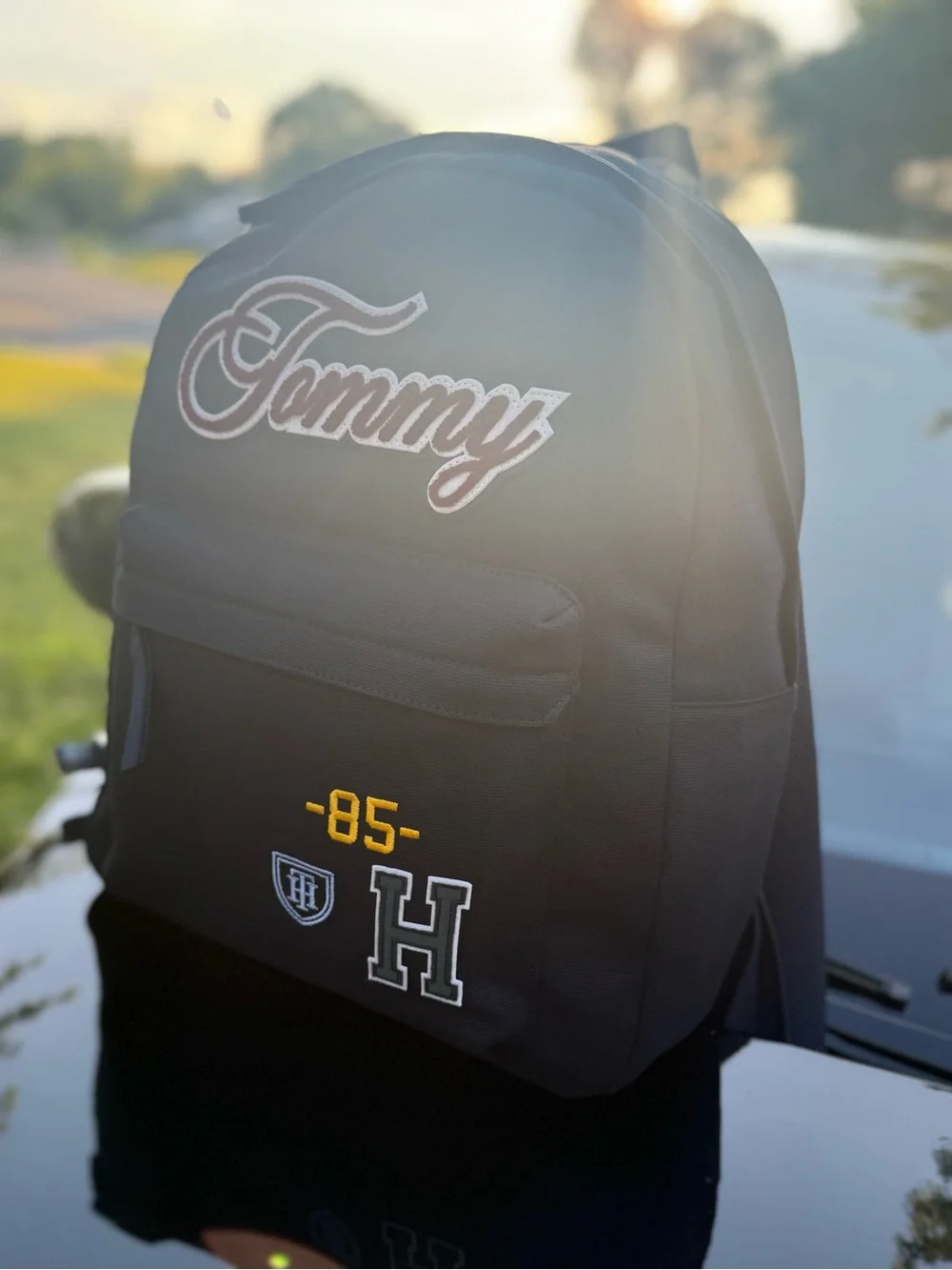 Tommy Hilfiger Black Backpack with Maroon Script Patch